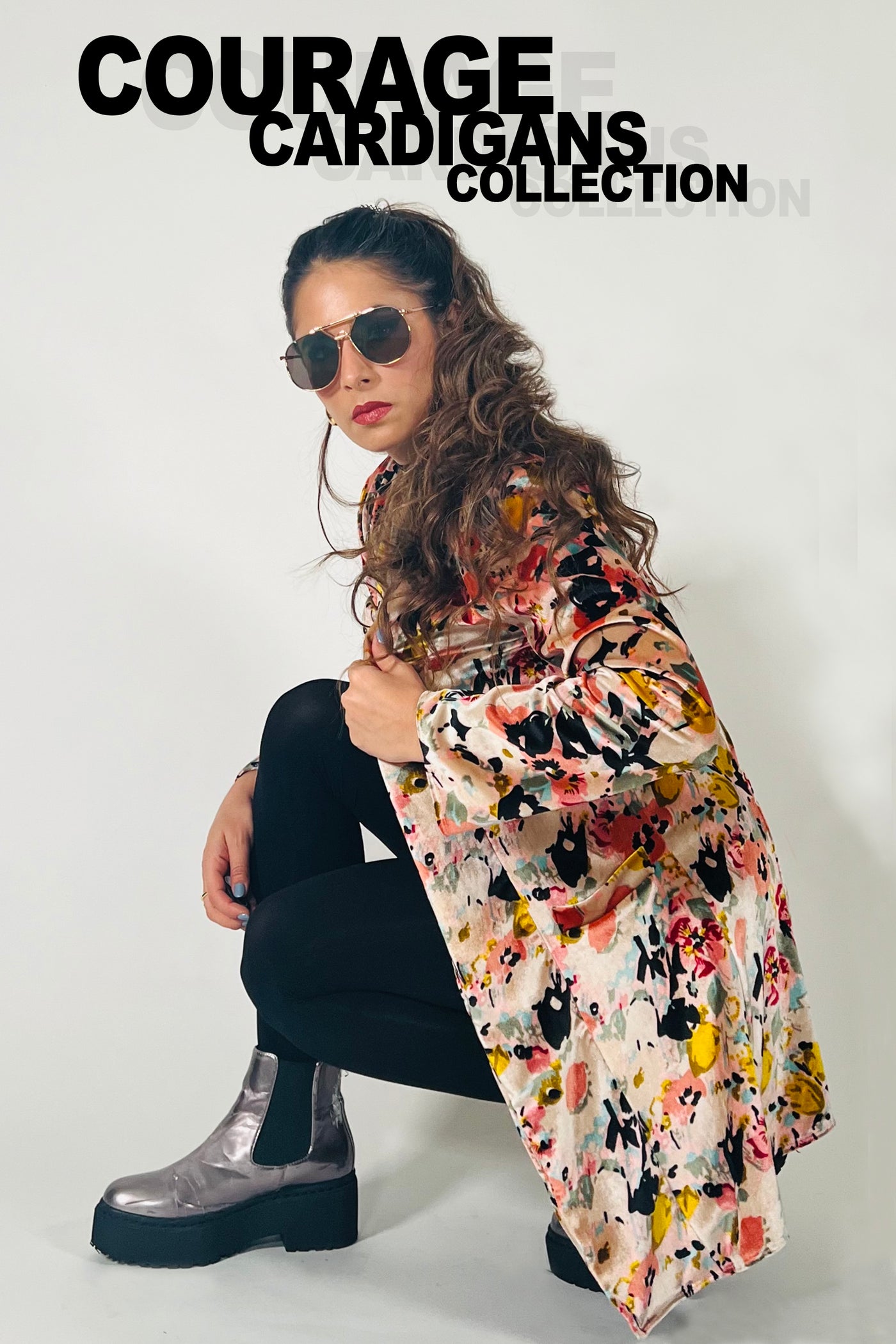 Woman wearing a floral cardigan with 'Courage Cardigans Collection' text above.