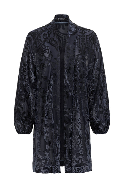 Dark blue patterned glittered coat on a white background